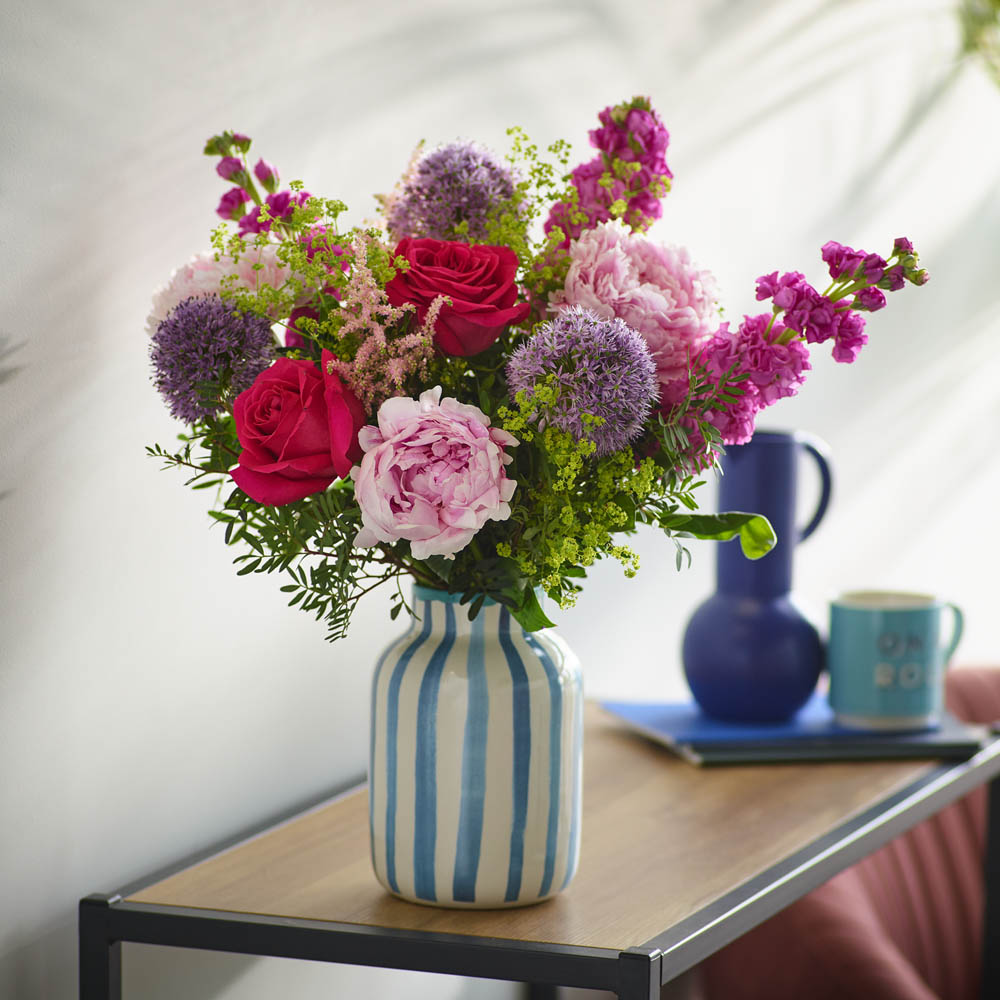 This dreamy bunch will feature at least three of the perfect puffball peonies along with other beautiful seasonal blooms